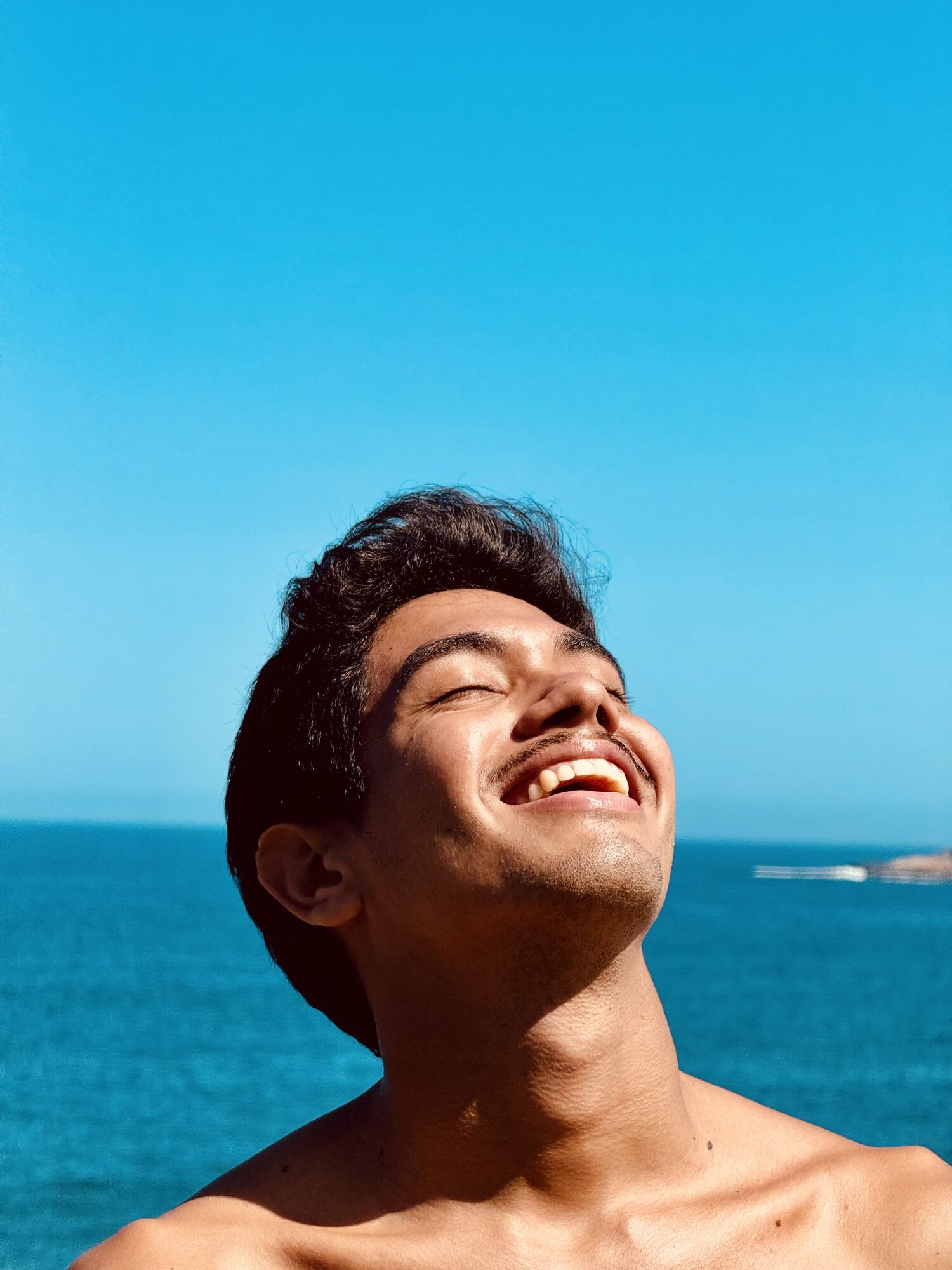Sun on face, eyes closed smile